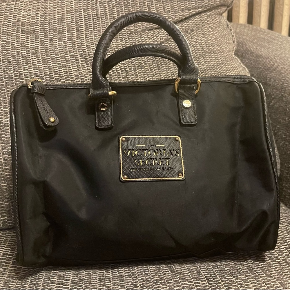 Victoria’s Secret Medium Size handbag, black & gold with hot pink interior.